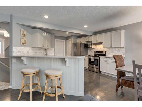 106 Cougar Plateau Way Sw, Calgary, AB - Indoor Photo Showing Kitchen With Upgraded Kitchen