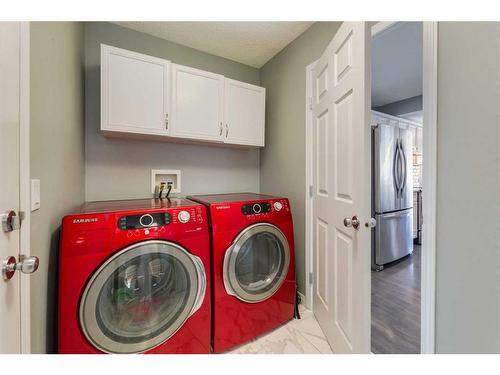 106 Cougar Plateau Way Sw, Calgary, AB - Indoor Photo Showing Laundry Room