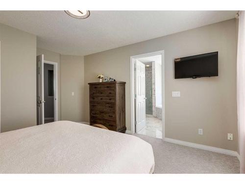 106 Cougar Plateau Way Sw, Calgary, AB - Indoor Photo Showing Bedroom