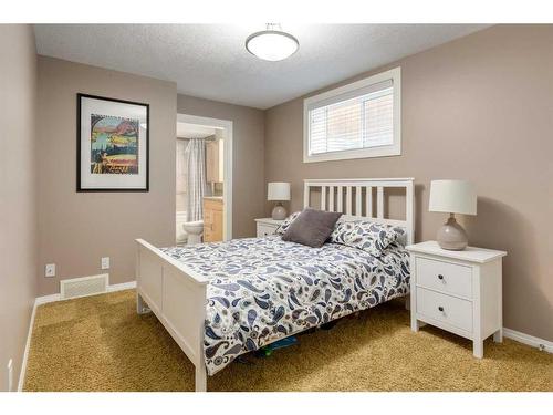 106 Cougar Plateau Way Sw, Calgary, AB - Indoor Photo Showing Bedroom