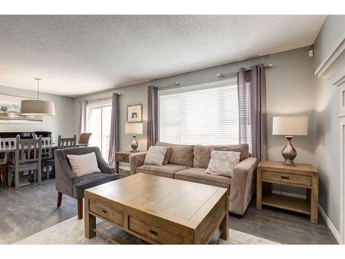 106 Cougar Plateau Way Sw, Calgary, AB - Indoor Photo Showing Living Room
