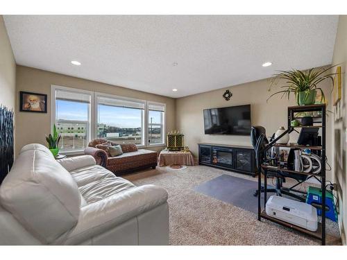7884 Martha'S Haven Park Ne, Calgary, AB - Indoor Photo Showing Living Room With Fireplace