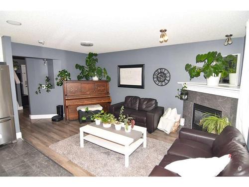244 Tarawood Place Ne, Calgary, AB - Indoor Photo Showing Living Room With Fireplace