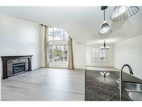 20 Auburn Bay Lane Se, Calgary, AB - Indoor Photo Showing Living Room With Fireplace
