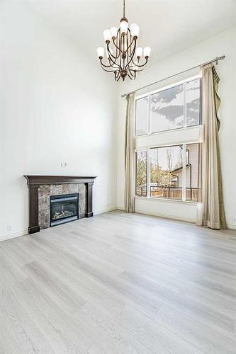 20 Auburn Bay Lane Se, Calgary, AB - Indoor Photo Showing Living Room With Fireplace