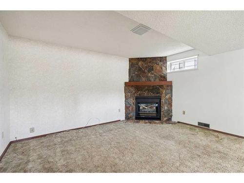 6920 5 Street Nw, Calgary, AB - Indoor Photo Showing Other Room With Fireplace