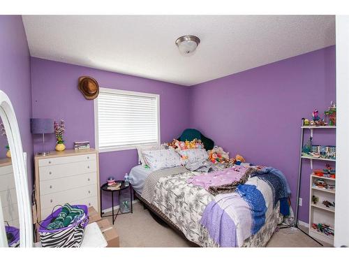 1747 High Country Drive Nw, High River, AB - Indoor Photo Showing Bedroom