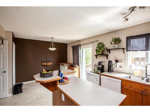 1747 High Country Drive Nw, High River, AB - Indoor Photo Showing Kitchen With Double Sink