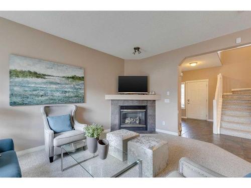 7 Weston Rise Sw, Calgary, AB - Indoor Photo Showing Living Room With Fireplace
