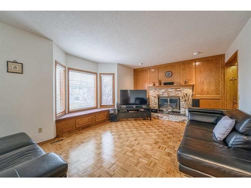 20 Edelweiss Drive Nw, Calgary, AB - Indoor Photo Showing Living Room With Fireplace