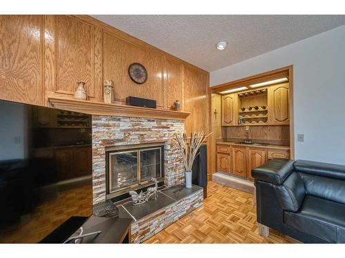 20 Edelweiss Drive Nw, Calgary, AB - Indoor Photo Showing Living Room With Fireplace