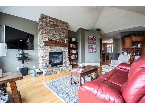 1611 Sunshine Way Se, High River, AB - Indoor Photo Showing Living Room With Fireplace