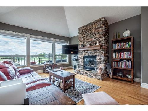 1611 Sunshine Way Se, High River, AB - Indoor Photo Showing Living Room With Fireplace