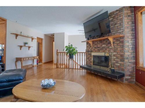 16 Templeridge Close Ne, Calgary, AB - Indoor Photo Showing Living Room With Fireplace