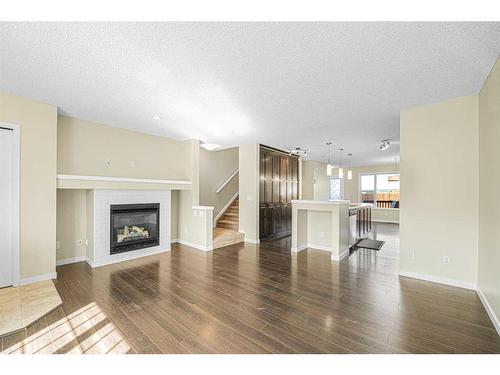 206 Cranford Park Se, Calgary, AB - Indoor Photo Showing Living Room With Fireplace