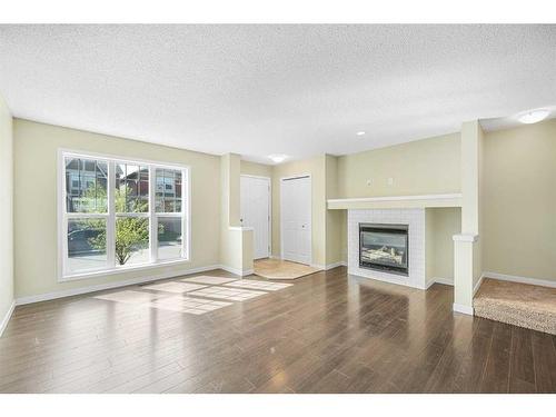 206 Cranford Park Se, Calgary, AB - Indoor Photo Showing Living Room With Fireplace