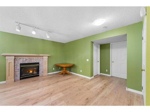 249 Hawkstone Drive Nw, Calgary, AB - Indoor With Fireplace