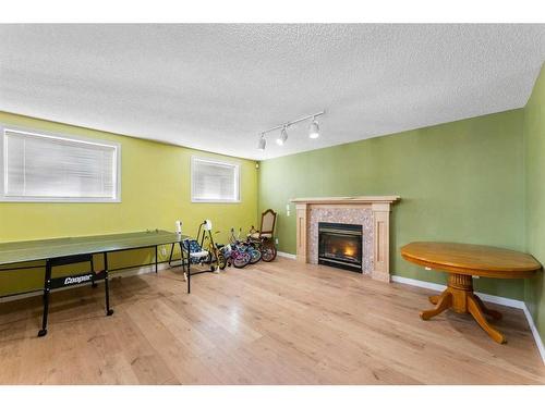 249 Hawkstone Drive Nw, Calgary, AB - Indoor With Fireplace
