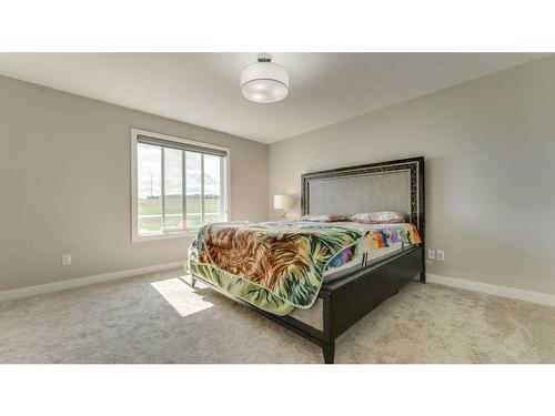 198 Carringsby Way Nw, Calgary, AB - Indoor Photo Showing Bedroom