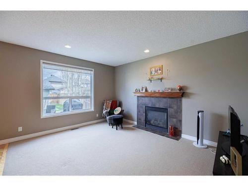 771 Prestwick Circle Se, Calgary, AB - Indoor Photo Showing Living Room With Fireplace