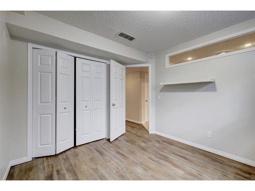 117 Rocky Ridge Cove Nw, Calgary, AB - Indoor Photo Showing Other Room