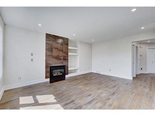 117 Rocky Ridge Cove Nw, Calgary, AB - Indoor With Fireplace