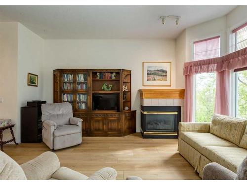 31-8020 Silver Springs Road Nw, Calgary, AB - Indoor Photo Showing Living Room With Fireplace