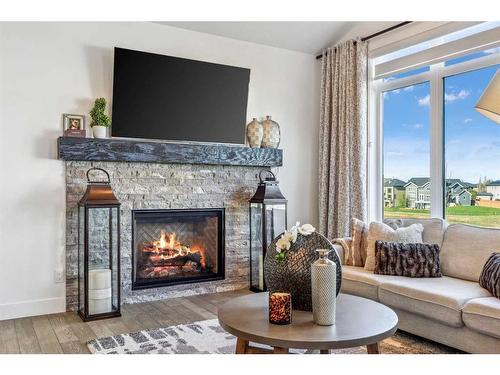 152 Rock Lake View Nw, Calgary, AB - Indoor Photo Showing Living Room With Fireplace