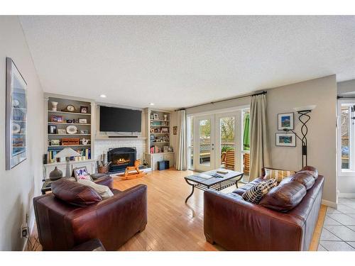197 Scenic Hill Close Nw, Calgary, AB - Indoor Photo Showing Living Room With Fireplace