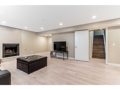 244 Dovely Place Se, Calgary, AB - Indoor Photo Showing Other Room With Fireplace