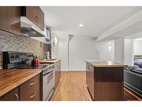 63 Templeridge Close Ne, Calgary, AB - Indoor Photo Showing Kitchen With Double Sink