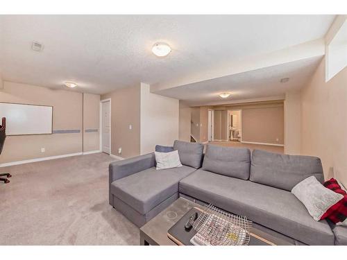 420 Mt Aberdeen Close Se, Calgary, AB - Indoor Photo Showing Living Room