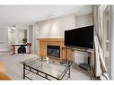 321-5115 Richard Road Sw, Calgary, AB  - Indoor With Fireplace 