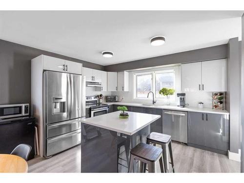 6-7 Westland Road, Okotoks, AB - Indoor Photo Showing Kitchen With Upgraded Kitchen