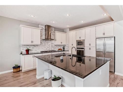 17 Riviera Place, Cochrane, AB - Indoor Photo Showing Kitchen With Upgraded Kitchen