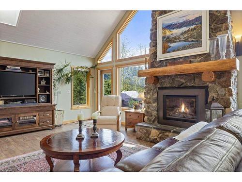 111-210 Hubman Landing, Canmore, AB - Indoor Photo Showing Living Room With Fireplace
