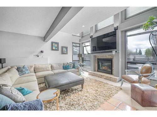 227 Schubert Hill Nw, Calgary, AB - Indoor Photo Showing Living Room With Fireplace