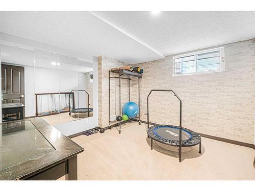 227 Schubert Hill Nw, Calgary, AB - Indoor Photo Showing Gym Room