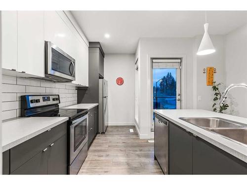 3571 69 Street Nw, Calgary, AB - Indoor Photo Showing Kitchen With Double Sink