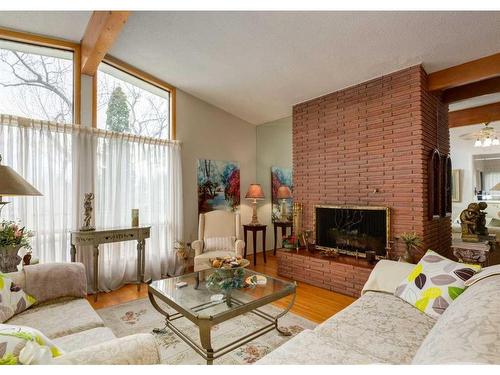 3120 10 Street Nw, Calgary, AB - Indoor Photo Showing Living Room With Fireplace