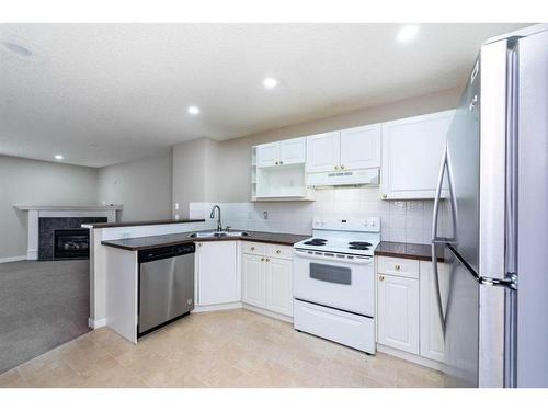 319 Coral Cove Ne, Calgary, AB - Indoor Photo Showing Kitchen With Double Sink
