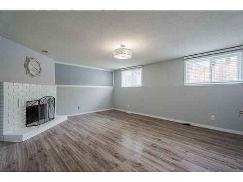 139 Pinemill Way Ne, Calgary, AB - Indoor With Fireplace