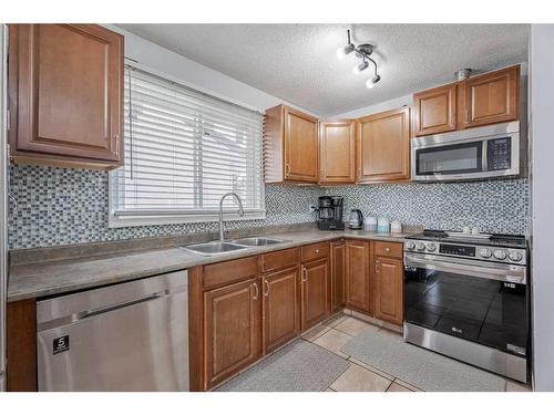 139 Pinemill Way Ne, Calgary, AB - Indoor Photo Showing Kitchen With Double Sink