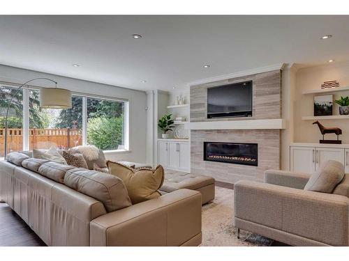 18 Varston Place Nw, Calgary, AB - Indoor Photo Showing Living Room With Fireplace