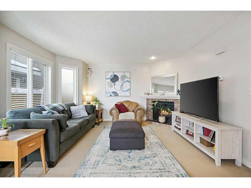 3-2417 28 Street Sw, Calgary, AB - Indoor Photo Showing Living Room With Fireplace