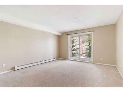 3303-10 Prestwick Bay Se, Calgary, AB - Indoor Photo Showing Other Room