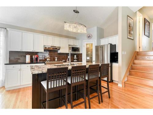 218 Bridlewood Road Sw, Calgary, AB - Indoor Photo Showing Kitchen With Double Sink