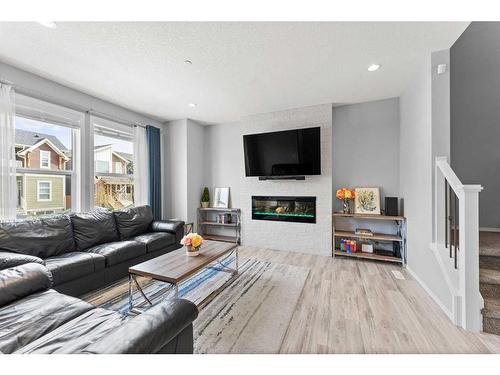 169 Howse Avenue Ne, Calgary, AB - Indoor Photo Showing Living Room With Fireplace