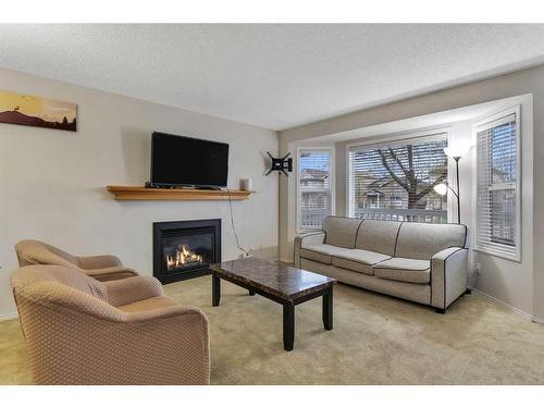 158 Tarawood Road Ne, Calgary, AB - Indoor Photo Showing Living Room With Fireplace