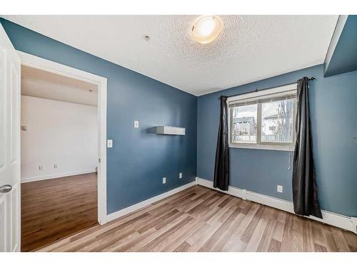 4117-403 Mackenzie Way Sw, Airdrie, AB - Indoor Photo Showing Other Room